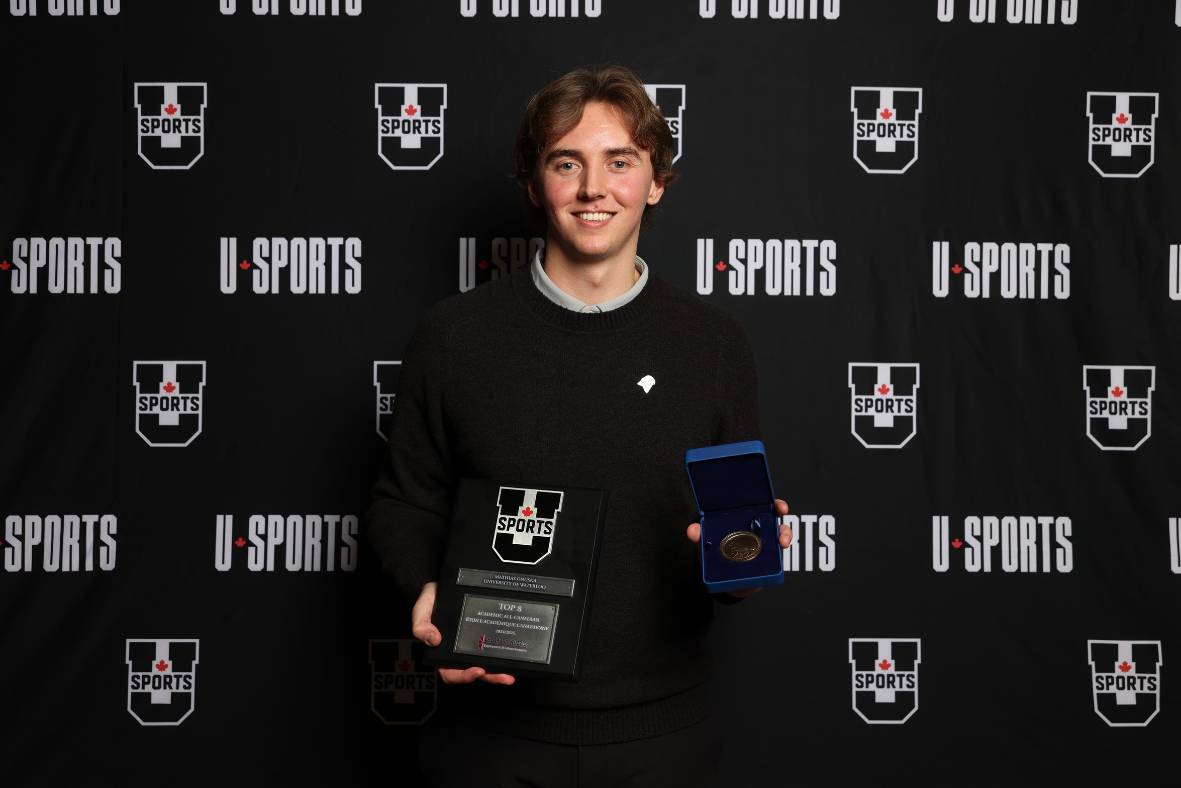 Photo of Waterloo Warriors Mathias Onuska with his U SPORTS awards