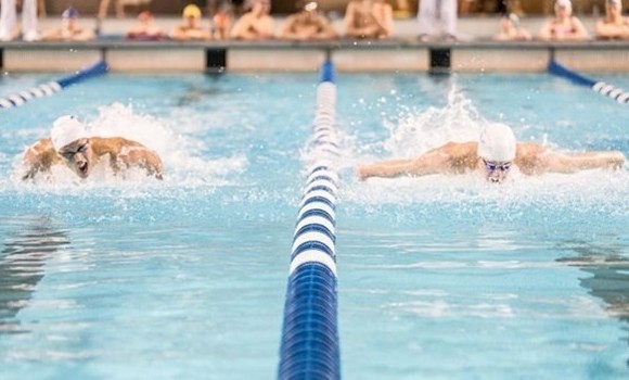Big night for Blues in tight men's race at CIS swimming championships